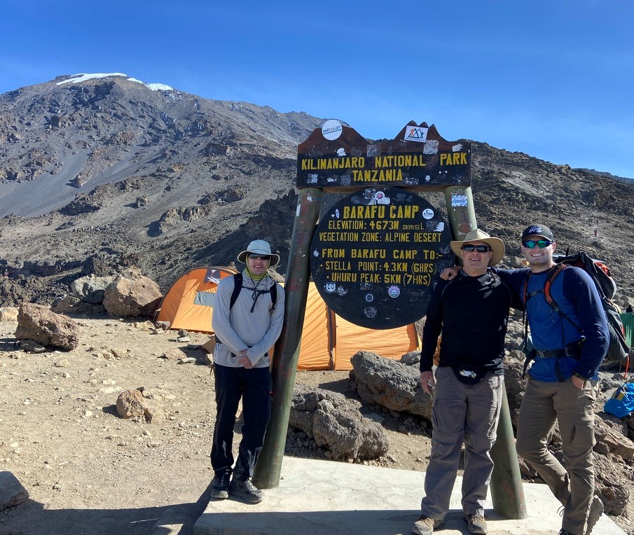 Wells, D. Westerbeck, Z. Westerbeck at base of Mt. Kilimanjaro